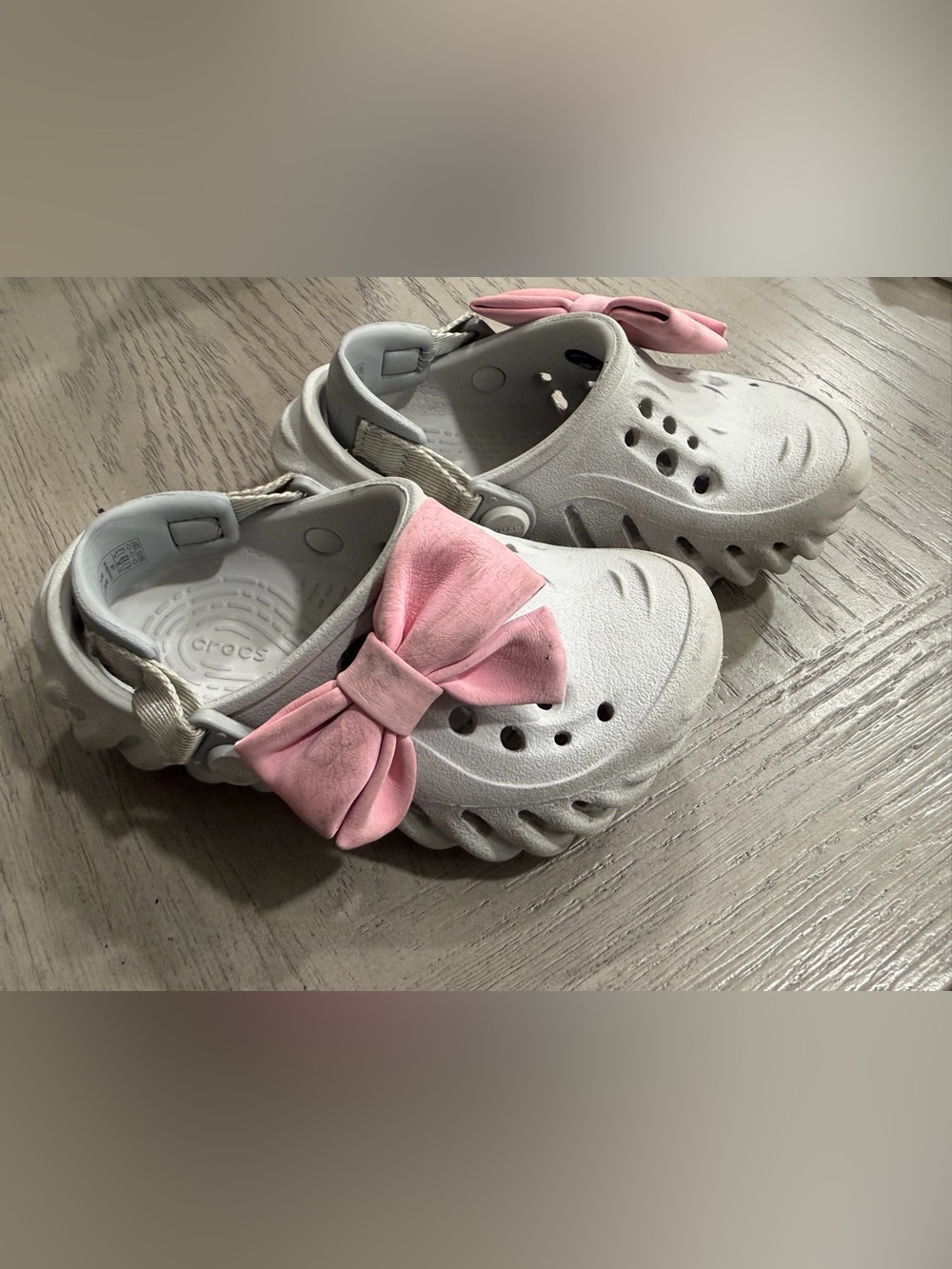 CROCS Kids White Clog Sandals with Pink Bow Accent